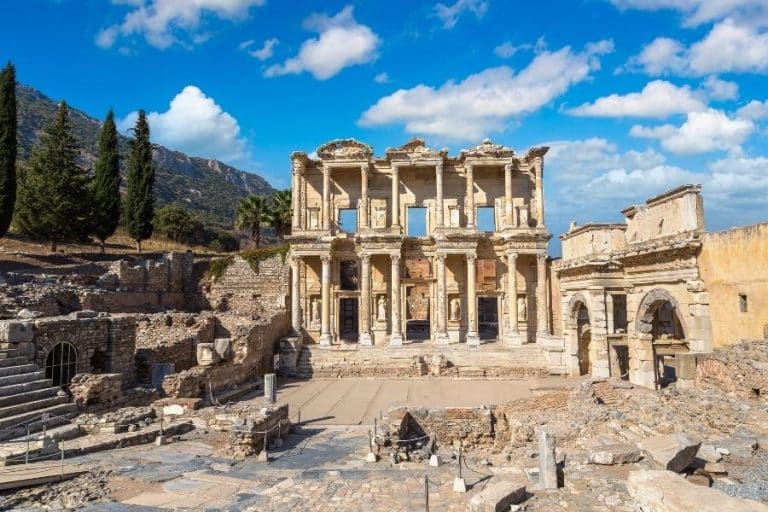 Ephesus Ancient City Ruins with well-preserved columns, pathways, and historical structures under a clear sky.