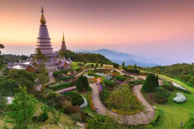 Scenic view of Doi Inthanon National Park in Thailand, featuring lush green forests, waterfalls, and mist-covered mountains. Ideal for nature lovers.